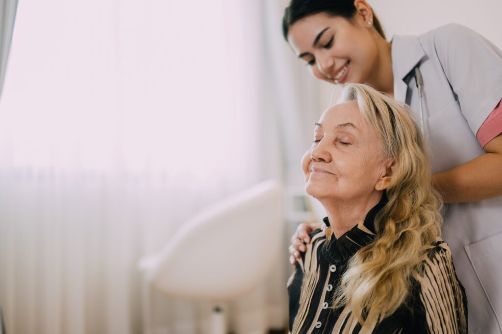 Senior patient with home care nurse, Happy senior woman talking with caregiver